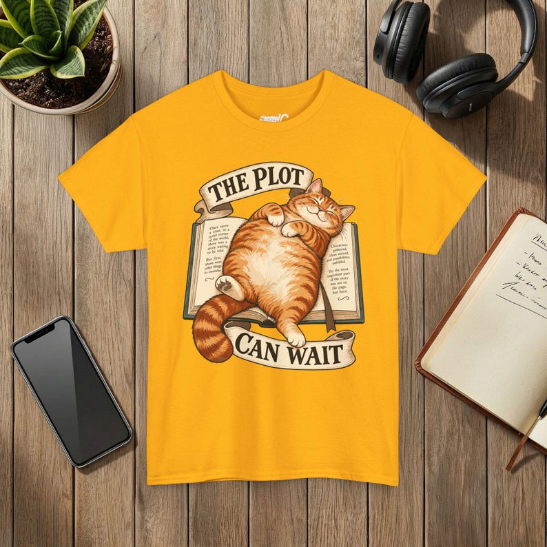 The Plot Can Wait Cat T-Shirt, Ginger Tabby on Book, Book Lover Gift Gold
