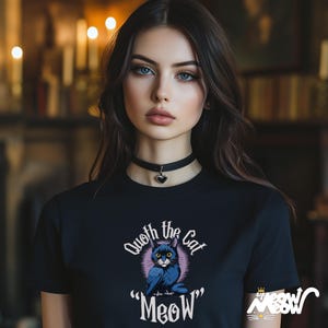 May include: Black t-shirt with a graphic of a blue cat with the text "Quoth the Cat "Meow""