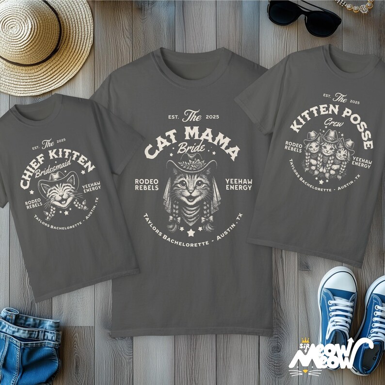 May include: Three gray t-shirts with rodeo-themed cat graphics. One shirt says "Cat Mama Bride," another says "Chief Kitten Bridesmaid," and the third says "Kitten Posse Crew." All shirts have the text "Taylors Bachelorette - Austin, TX."