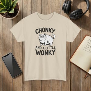 Funny Cat T-Shirt: Chonky, Wonky-Eyed Graphic Tee Sand