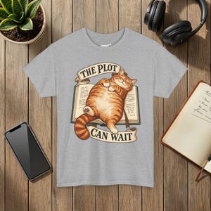 The Plot Can Wait Cat T-Shirt, Ginger Tabby on Book, Book Lover Gift Sport Grey