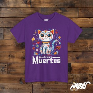 Día de los Muertos Cat T-Shirt, Sugar Skull Cat Design, Mexican Holiday Celebration Tee, Perfect Gift for Día de Muertos Purple