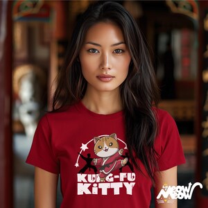 May include: Red t-shirt with a cartoon cat doing karate and the text "Kung-Fu Kitty".