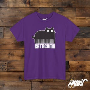Catacomb Pun Unisex T-Shirt, Funny Hairdresser Cat Tee Purple
