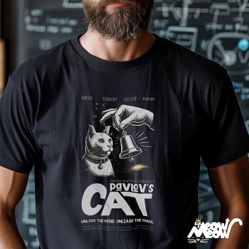 May include: Black t-shirt featuring a white graphic of a cat with a bell. The graphic is a parody of a movie poster and reads "Davide Finchhill Presents Pavlov's Cat. Unlock the mind. Unleash the chaos."