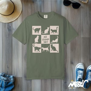 Minimalistyczna koszulka z sylwetką kota: Komfortowa koszulka unisex Moss
