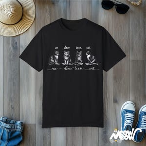 Un Deux Trois Cat T-Shirt: Funny French Pun, Comfort Colors Tee Black
