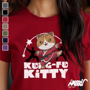 May include: Red t-shirt with a cartoon cat wearing a karate uniform and the text "Kung-Fu Kitty".