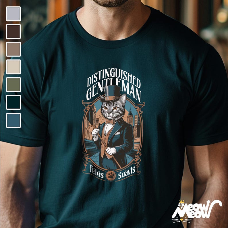 May include: A dark teal t-shirt with a graphic of a cat wearing a top hat and holding a cane. The text "Distinguished Gentleman" is above the cat and "Feles Suavls" is below the cat.