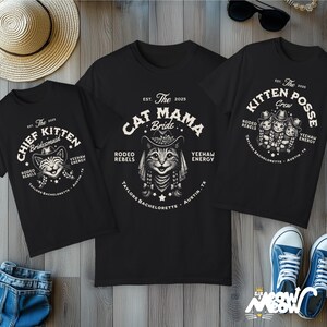 May include: Three black t-shirts with cat-themed graphics. One says "Chief Kitten Bridesmaid," another "Cat Mama Bride," and the third "Kitten Posse Crew." All shirts feature a cat wearing a cowboy hat and the text "Rodeo Rebels, Yeehaw Energy, Taylors Bachelorette, Austin, TX."