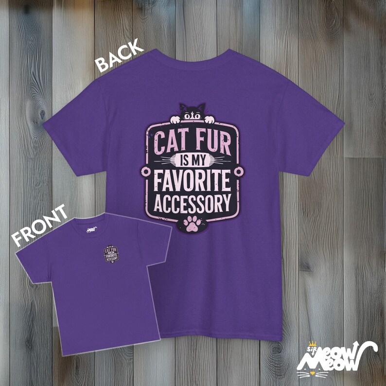 May include: Purple t-shirt with a pink and black graphic that says "Cat fur is my favorite accessory".