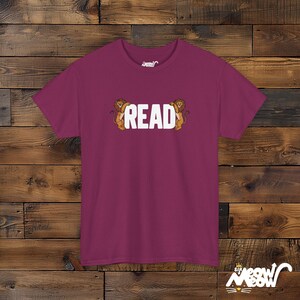 READ Between the Lions T-Shirt: Literacy Pun Gift Berry