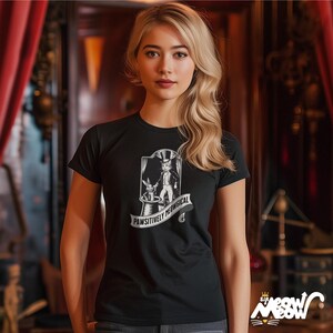 May include: Black t-shirt with a white graphic of a cat in a top hat pulling a rabbit out of a hat. The text "Pawsitively Meowgical" is printed below the graphic.