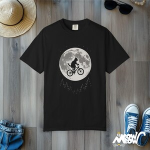 Comfort Colors Cat Moon T-Shirt: Flying Cat on Bike Graphic Tee Black