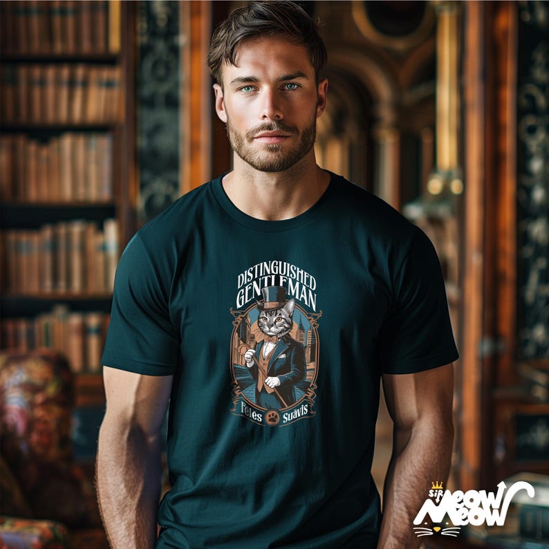 May include: A dark green t-shirt with a graphic of a cat wearing a top hat and bow tie. The text on the shirt reads "Distinguished Gentleman" and "Fetes Suavts".