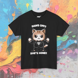 May include: Black t-shirt with a cartoon cat wearing a tuxedo and saying "Paws Off!! She's Mine!!"