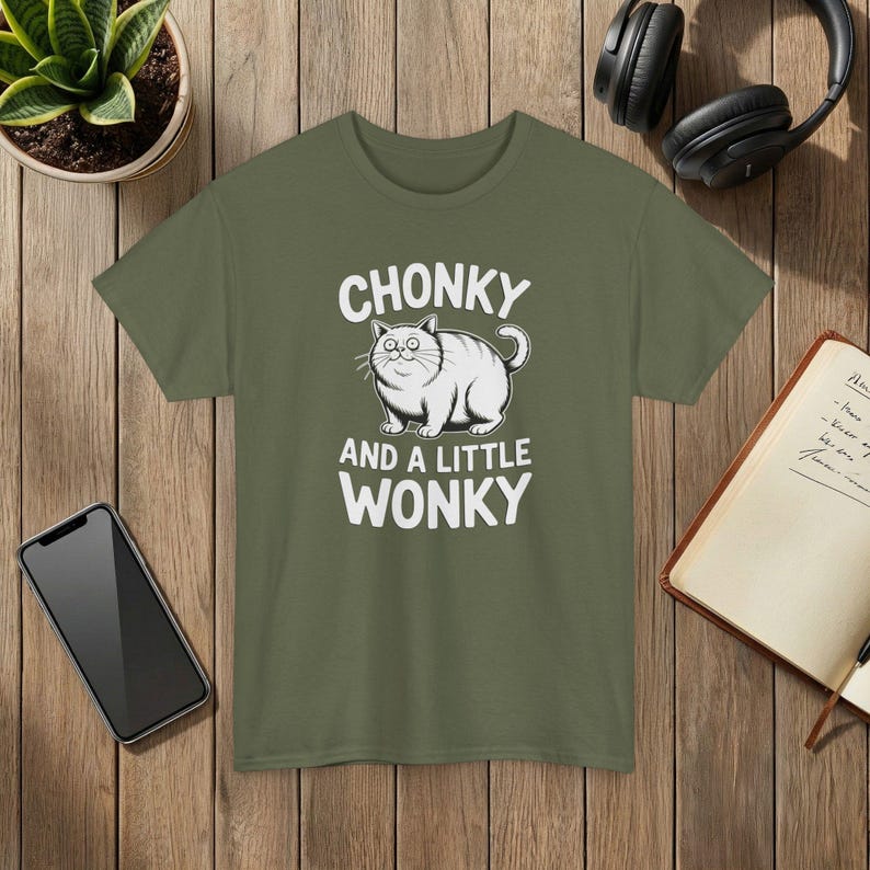 Funny Cat T-Shirt: Chonky, Wonky-Eyed Graphic Tee Military Green