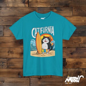 Catifurnia Unisex Shirt: Fun Surfing Cat Design, Beach Lover Gift Tropical Blue