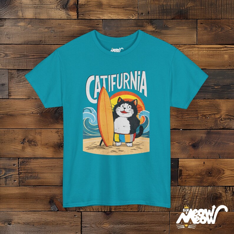 Catifurnia Unisex Shirt: Fun Surfing Cat Design, Beach Lover Gift Tropical Blue