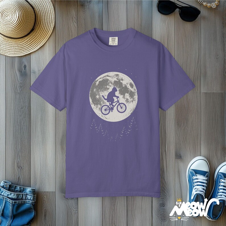 Comfort Colors Cat Moon T-Shirt: Flying Cat on Bike Graphic Tee Grape