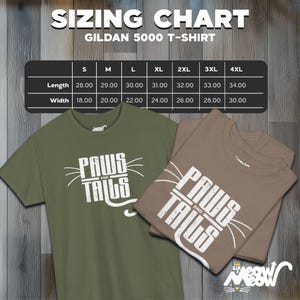 May include: Sizing chart for Gildan 5000 t-shirts in sizes S through 4XL. The chart shows the length and width measurements in inches for each size. The image also shows two t-shirts with the text "Paws and Tails" printed on them.
