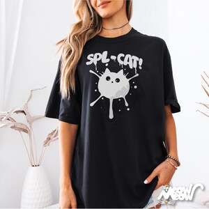 May include: Black t-shirt with a white graphic of a cat with the text "SPL-CAT!" printed on it.