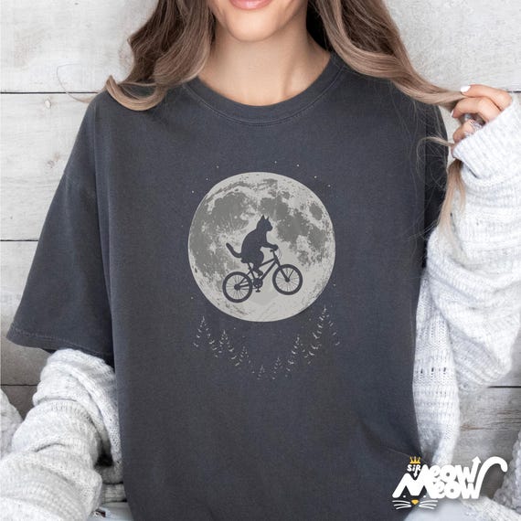Comfort Colors Cat Moon T-Shirt: Flying Cat on Bike Graphic Tee