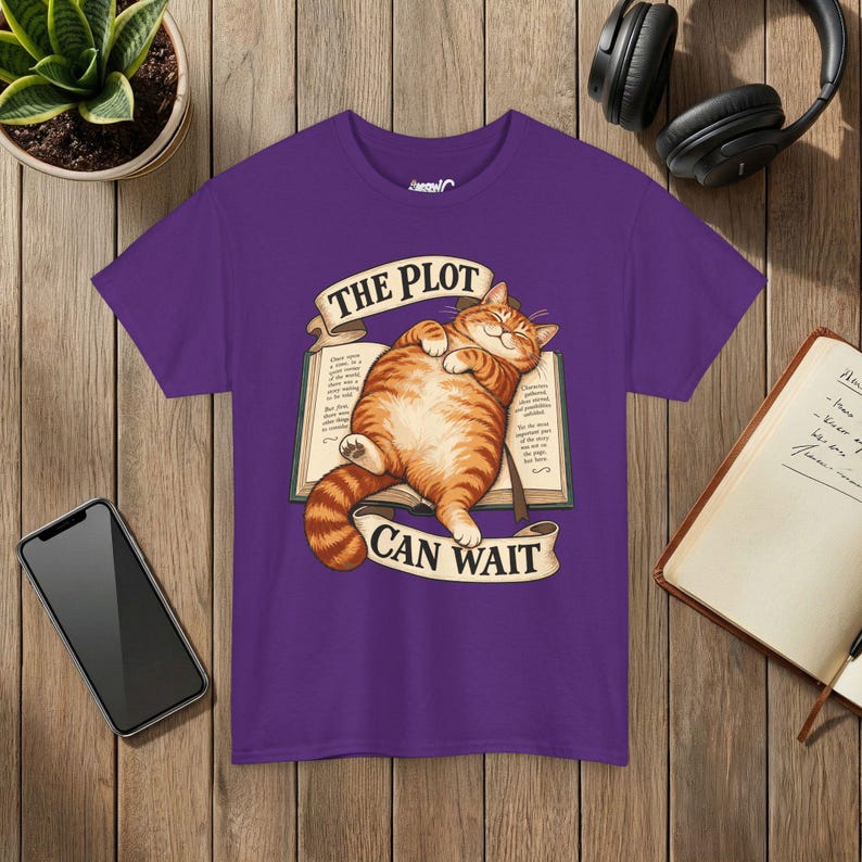 The Plot Can Wait Cat T-Shirt, Ginger Tabby on Book, Book Lover Gift Purple