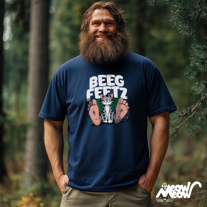 May include: A navy blue t-shirt with a cartoon cat with big feet and the text "Beeg Feetz".