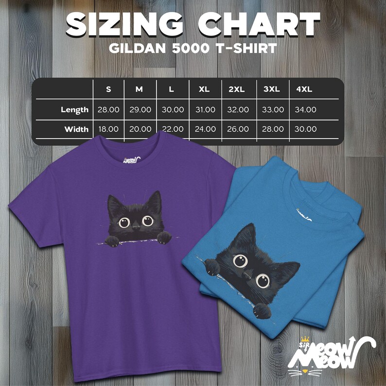 May include: Sizing chart for Gildan 5000 t-shirts, showing measurements in inches for length and width. Sizes range from S to 4XL. The chart is displayed on a wooden background with two t-shirts featuring a black cat peeking out from behind a fold of fabric. One t-shirt is purple and the other is blue.