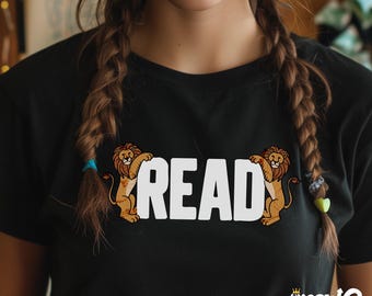 May include: Black t-shirt with a white graphic of two lions holding up the word "READ".