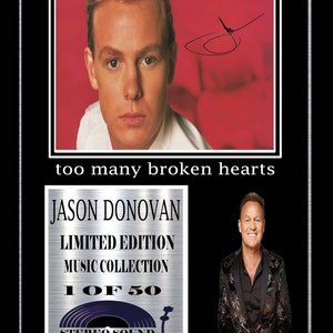 May include: A silver plaque featuring a black and white photograph of Jason Donovan, a singer, with the text "too many broken hearts". The plaque also includes the text "Jason Donovan Limited Edition Music Collection 1 of 50 Stereo Sound".