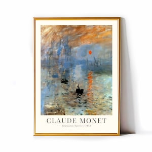 May include: A framed print of Claude Monet's Impression, Sunrise, a famous painting depicting a hazy sunrise over a harbour with a red sun and boats in the water.