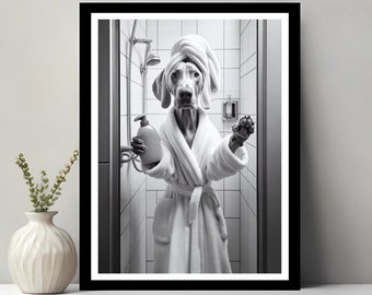 May include: A black and white photo of a dog in a white bathrobe and towel on its head, holding a bottle of shampoo in a bathroom.