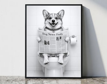 May include: A black and white framed wall art print featuring a Corgi dog sitting on a white toilet, holding and reading a newspaper titled Dog News Daily. The background consists of white square bathroom tiles and a toilet paper roll holder.