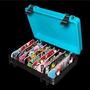 May include: A black case with a bright blue lid, open to reveal several colorful finger skateboards. Each board features unique graphics and designs, with red, yellow, and green wheels. The case is set against a black background.