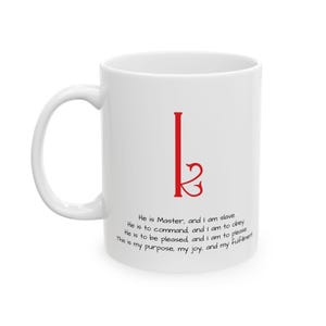 May include: White ceramic mug with a red stylised letter "k" and a quote: "He is Master, and I am slave. He is to command and I am to obey. He is to be pleased, and I am to please. This is my purpose, my joy, and my fulfillment."