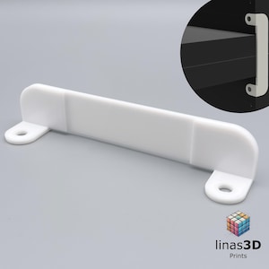 May include: White plastic shelf bracket with rounded edges and two holes for mounting. The bracket is designed to support a shelf or other object.
