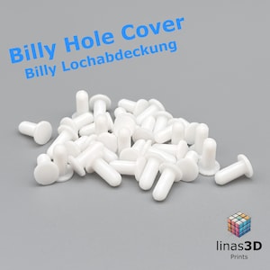 Op de afbeelding: Een stapel witte plastic gatkappen, ook wel bekend als Billy gatkappen of Billy Lochabdeckung. Deze doppen worden gebruikt om gaten in meubels te vullen.