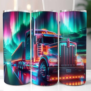 May include: A stainless steel tumbler featuring a vibrant design of a semi-truck driving on a highway under the aurora borealis. The truck is illuminated with neon lights, and the sky displays pink, green, and blue hues.