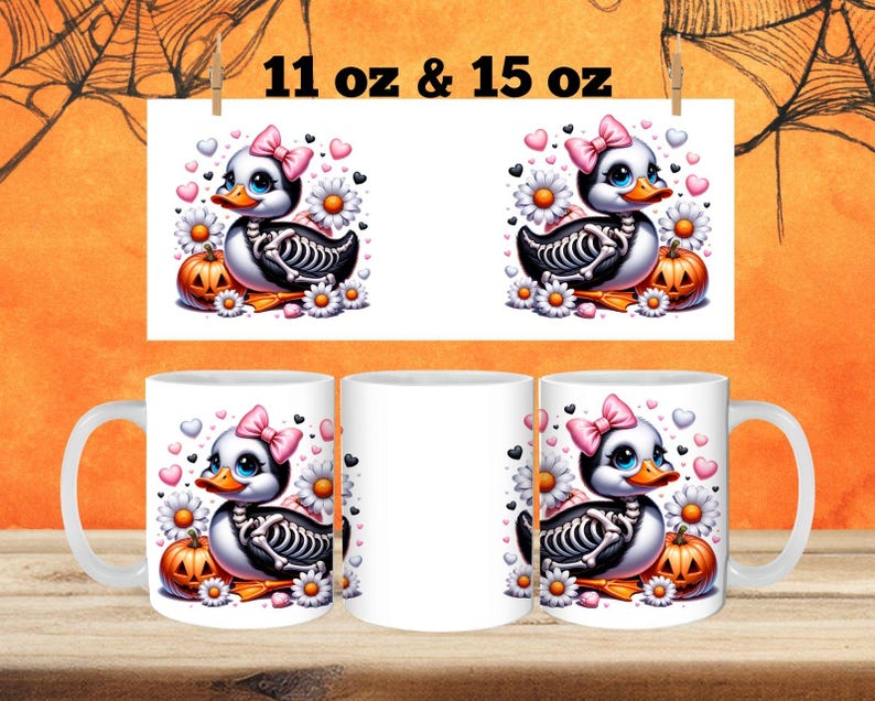 May include: Two white ceramic mugs with a Halloween-themed design. The design features a cartoon skeleton duck with pink bows, holding a pumpkin. The mugs are available in 11 oz and 15 oz sizes.