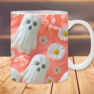 Pu&ograve; includere: Tazza in ceramica bianca con un design rosa e bianco con fantasmi e margherite.
