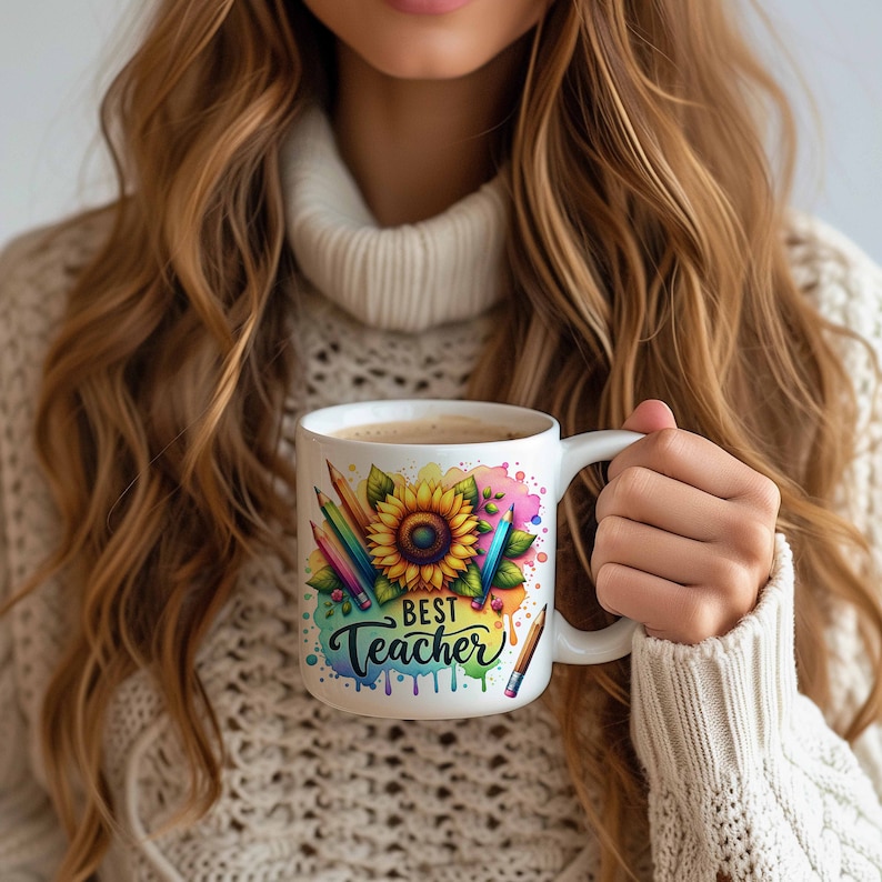 May include: White ceramic mug with a colourful watercolour design featuring a sunflower, pencils, and the text "Best Teacher".