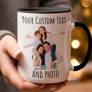 May include: White ceramic mug with a black handle. The mug has a photo of a family of four on it. The text "YOUR CUSTOM TEXT AND PHOTO" is printed on the mug.