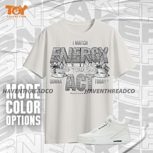 Camiseta de lona Bella de la colección Toy AJ 3 Pure Money Match My Energy, color gris, plateado y blanco.