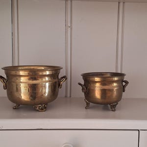 Vintage brass flower pots from Sweden.