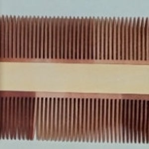 May include: A wooden comb with two rows of teeth. The comb is light brown in colour and has a smooth, polished finish.