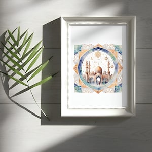 May include: A framed watercolor painting of a mosque with a golden dome and minarets. The mosque is surrounded by a blue and gold geometric pattern. The painting is set against a white background.