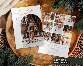 May include: A white Christmas card with the words "Merry Christmas" in gold script. The front features a family photo inside an archway, and the back has multiple family photos. The text "Wishing you joy and cheer this holiday season" is also included.