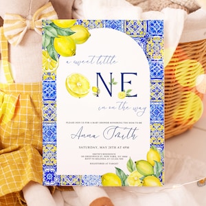 May include: Baby shower invitation with a lemon theme. The invitation features the text "a sweet little ONE in on the way" and the name "Anna Taith". The design includes watercolor lemons and a blue and white tile border.